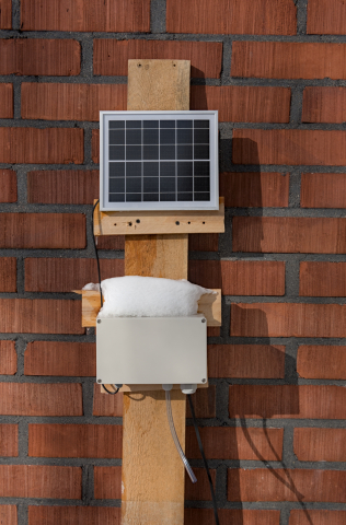 environmental monitoring station consiting of small solar panel and plastic casing