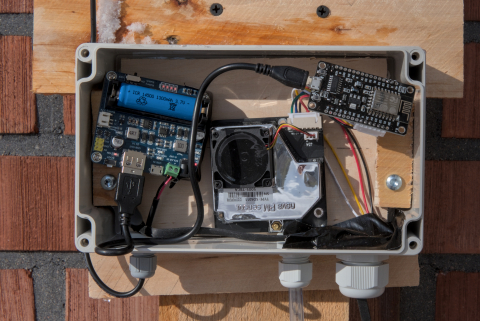 opened monitoring station with microcontroller, sensor, and other electronic parts